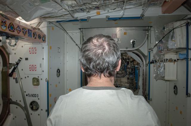 NASA image: Hadfield before a Haircut in Node 1