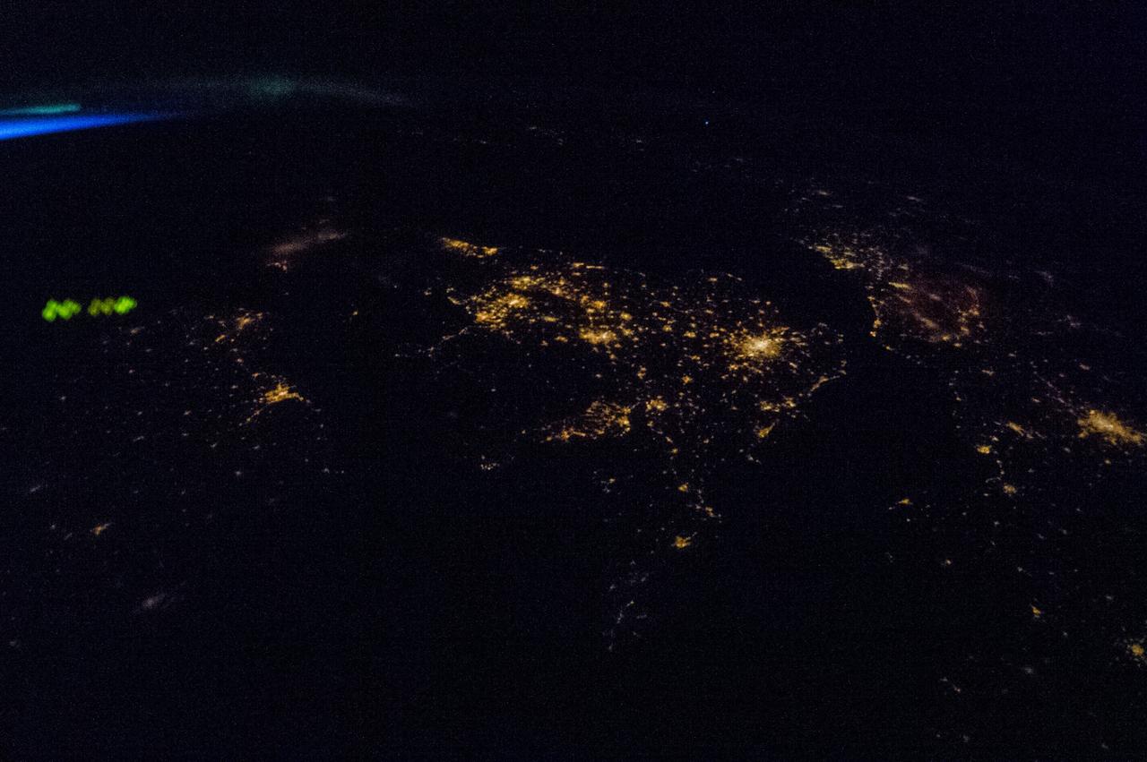 Earth observation taken by the Expedition 35 crew aboard the ISS. Night view of city lights and airglow.