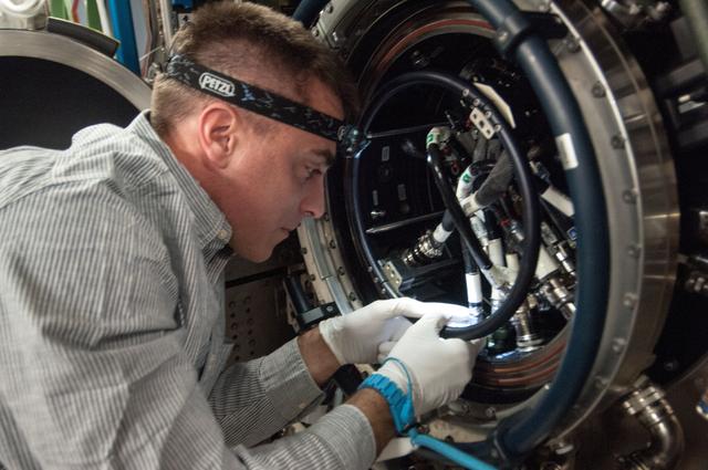 NASA image: Cassidy conducts MDCA Fuel Reservoir Remove and Replace OPS