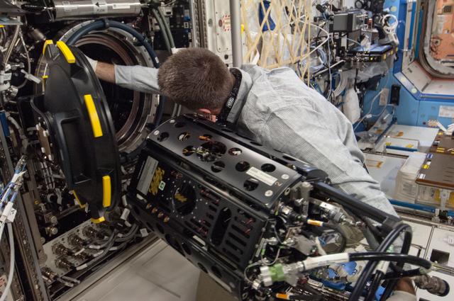 NASA image: Cassidy conducts MDCA Fuel Reservoir Remove and Replace OPS