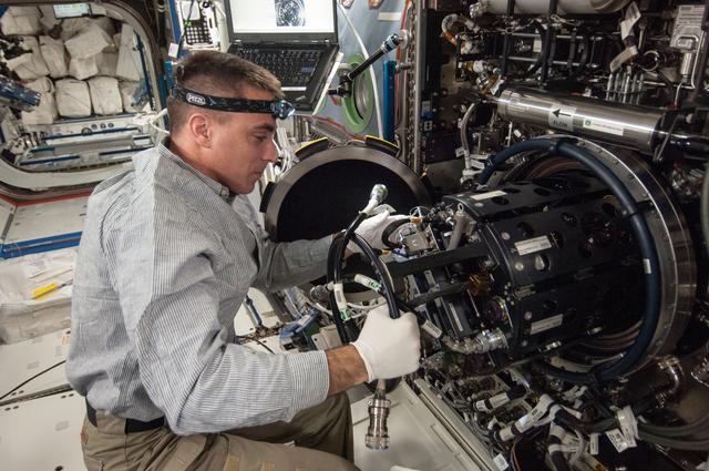 NASA image: Cassidy conducts MDCA Fuel Reservoir Remove and Replace OPS