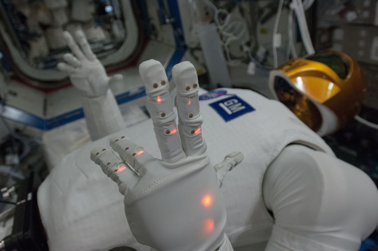ISS035-E-017869 (10 April 2013) --- Robonaut 2, the first humanoid robot to travel to space and the first U.S.-built robot to visit the space station, performs a few finger motion and sensor checkouts aboard the Earth-orbiting outpost.