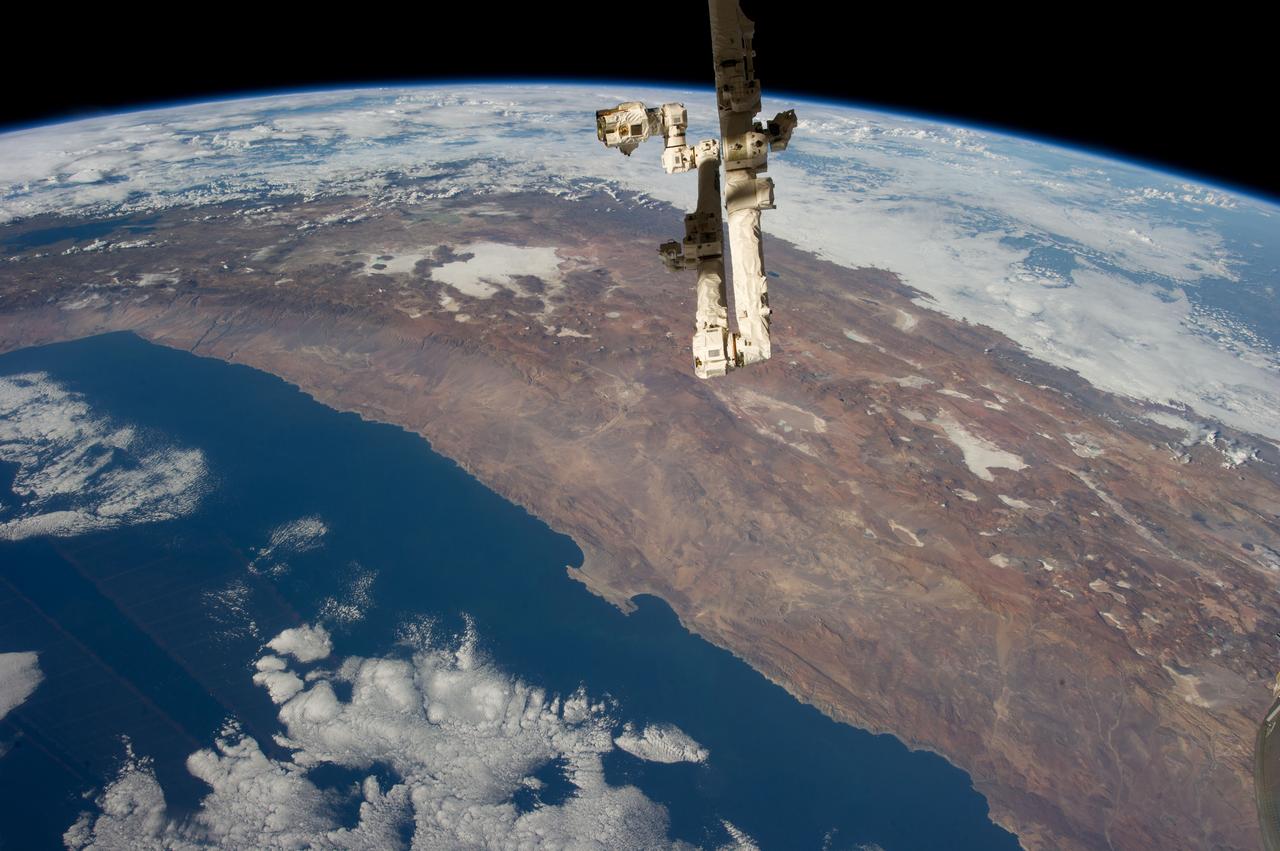 Earth observation taken by the Expedition 35 crew aboard the ISS. The Canadarm2 Space Station Remote Manipulator System (SSRMS) is in view.