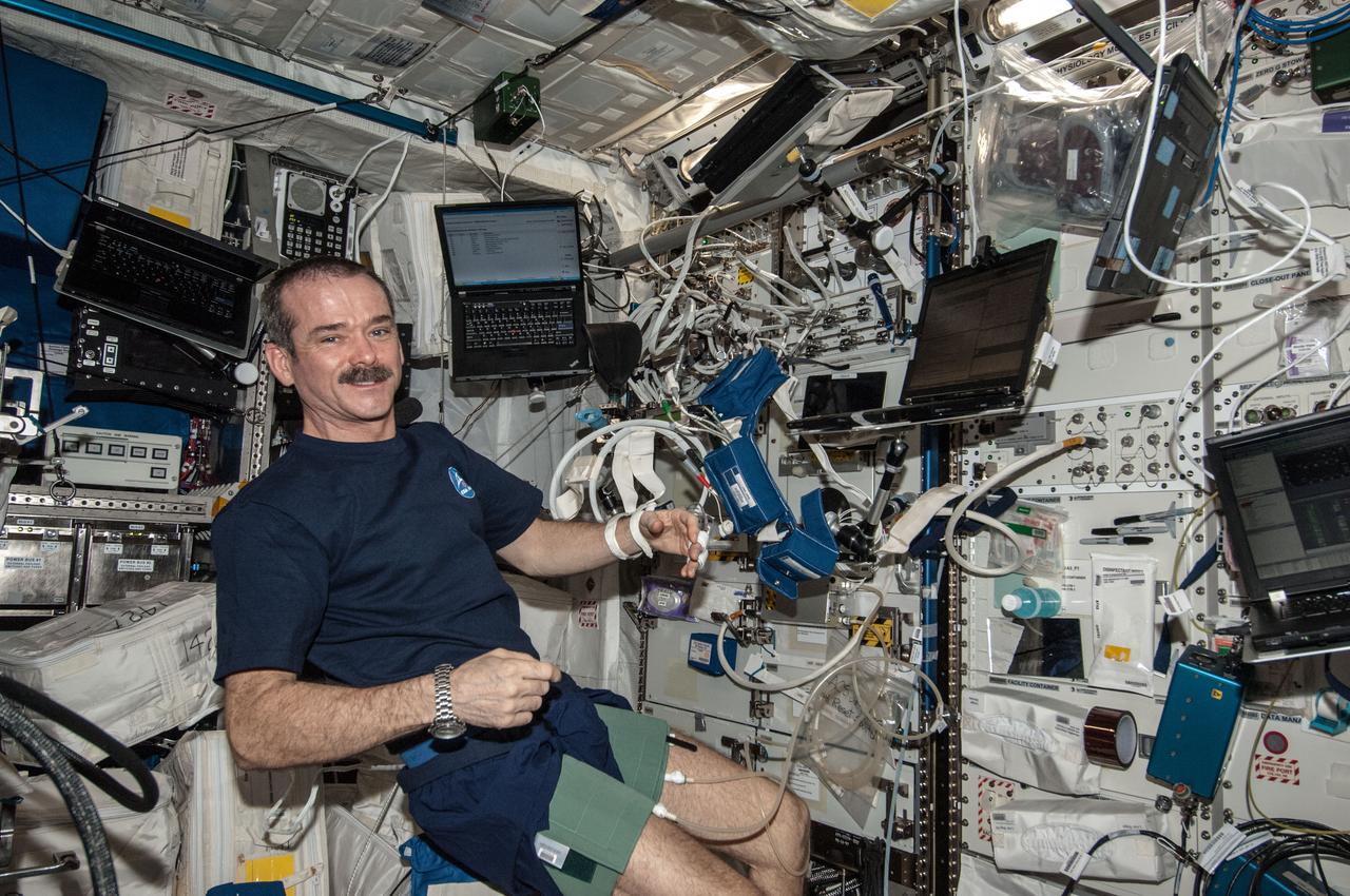 ISS035-E-022360 (17 April 2013) --- In support of the Blood Pressure Regulation Experiment (BP Reg), Expedition 35 Commander Chris Hadfield of the Canadian Space Agency is pictured after having set up the Human Research Facility (HRF) PFS (Pulmonary Function System) and the European Physiology Module (EPM) Cardiolab (CDL) Leg/Arm Cuff System (LACS) and conducting the first ever session of this experiment.  The test, which will be repeated using other crew members as well, will help to identify the astronauts who could benefit from countermeasures before returning to Earth. Thus, this method has great potential for astronaut health monitoring during future long-term space flights and it also has important implications for testing of individuals on Earth, especially the elderly, who are at risk for fainting. The research will also allow demonstrating the feasibility of obtaining a set of indicators of overall cardiovascular regulation from the non-invasive measurement of continuous blood pressure.
