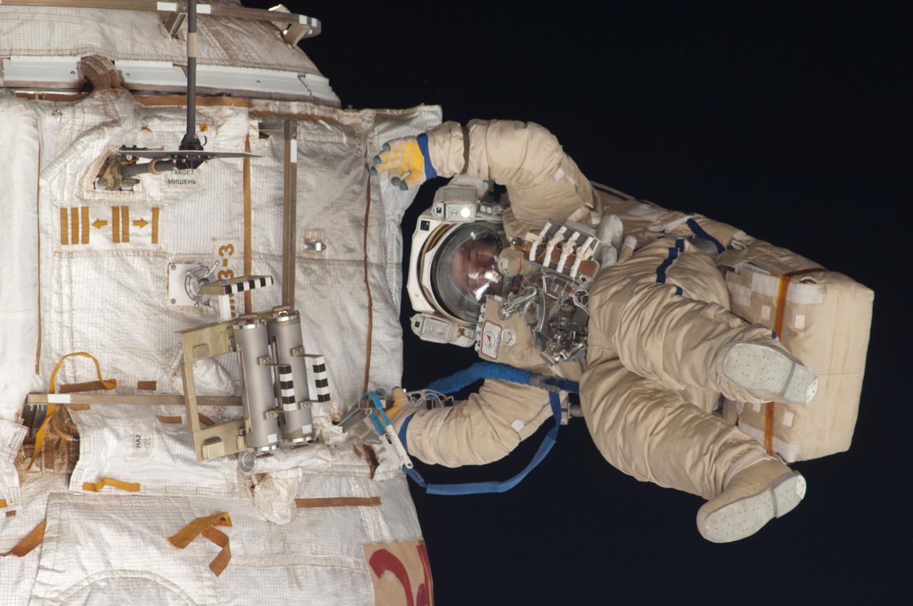 ISS035-E-023968 (19 April 2013) --- Expedition 35 Russian cosmonaut Roman Romanenko translates outside the International Space Station on April 19, 2013, during the first spacewalk of the Expedition 35 mission. Romanenko and Pavel Vinogradov (out of frame) went on to spend about six hours upgrading the station?s exterior hardware.