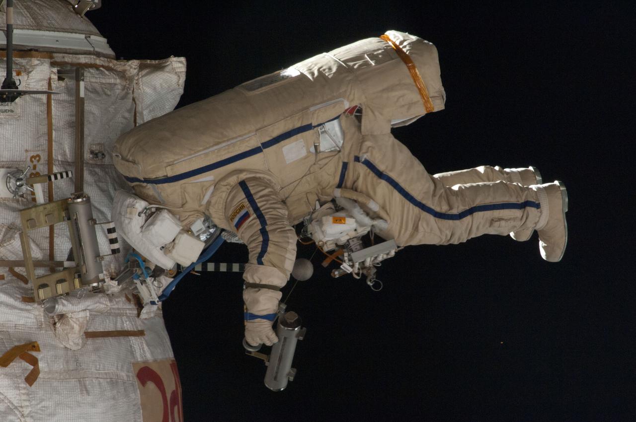 ISS035-E-023978 (19 April 2013) --- Expedition 35 Russian cosmonaut Roman Romanenko translates outside the International Space Station on April 19, 2013, during the first spacewalk of  the Expedition 35 mission. Romanenko and Pavel Vinogradov (out of frame) went on to spend about six hours upgrading the station’s exterior hardware. 