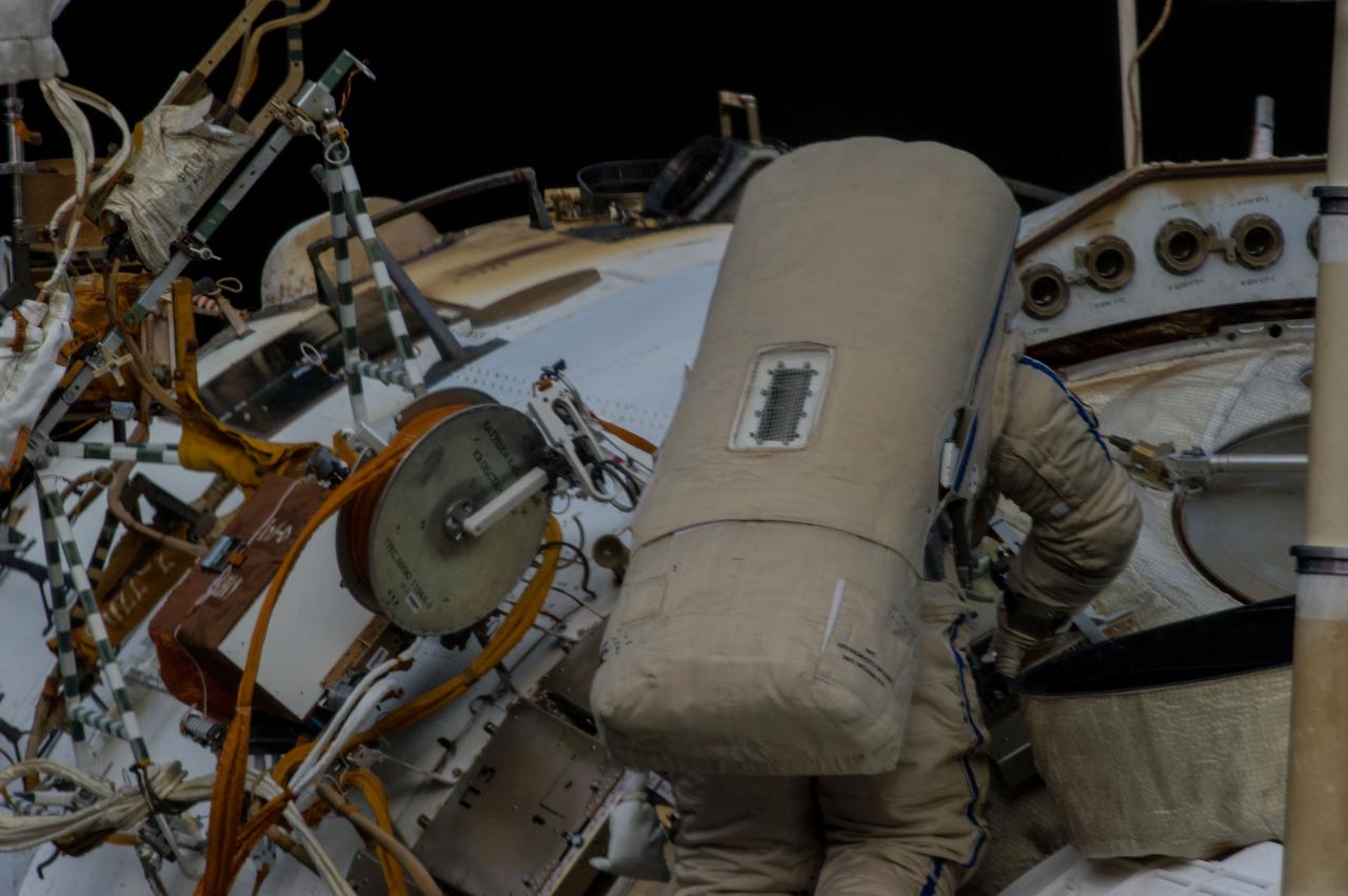 ISS035-E-024725 (19 April 2013) --- Expedition 35 Russian cosmonaut Roman Romanenko translates outside the International Space Station on April 19, 2013, during the first spacewalk of  the Expedition 35 mission. Romanenko and Pavel Vinogradov (out of frame) went on to spend about six hours upgrading the station?s exterior hardware.