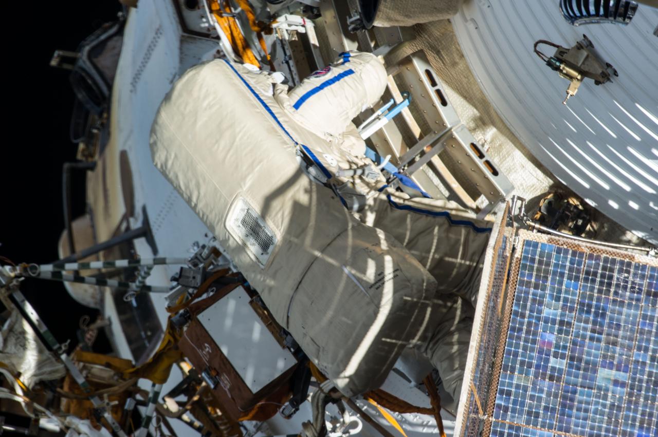 ISS035-E-024731 (19 April 2013) --- Expedition 35 Russian cosmonaut Roman Romanenko translates outside the International Space Station on April 19, 2013, during the first spacewalk of  the Expedition 35 mission. Romanenko and Pavel Vinogradov (out of frame) went on to spend about six hours upgrading the station?s exterior hardware.