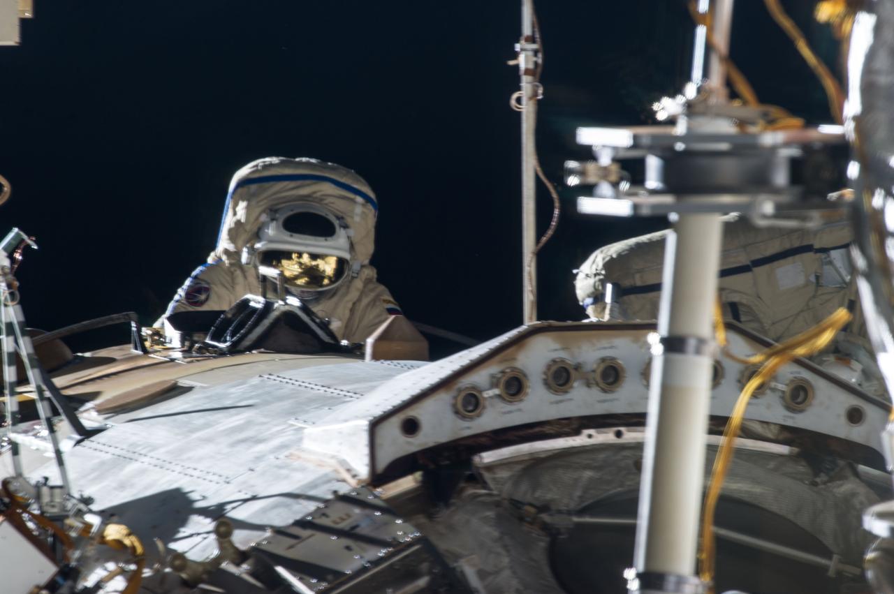 ISS035-E-024800 (19 April 2013) --- Expedition 35 Russian cosmonaut  Pavel Vinogradov translates outside the International Space Station on April 19, 2013, during the first spacewalk of  the Expedition 35 mission.   Vinogradov and fellow cosmonaut Roman Romanenko  (out of frame)  went on to spend about six hours upgrading the station?s exterior hardware.