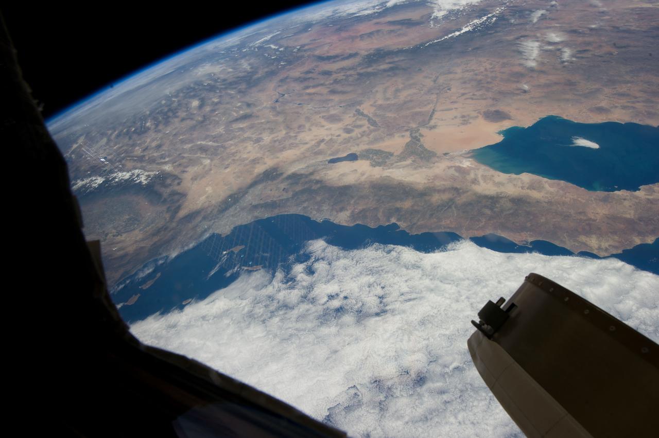 ISS035-E-027431 (23 April 2013) --- This oblique Expedition 35 image from the International Space Station shows parts of Mexico, California and Nevada. The Los Angeles Basin can be easily delineated at left center. If the nomenclature for the body of water in the upper right quadrant of the image were the subject of a trivia question, the answer might be "all the above," as it is recognized by a number of names.  They include the Gulf of California,  Sea of Cortez, Sea of Cortes, Vermilion Sea as well as its local designations in the Spanish language as Mar de Cortes or Mar Bermejo or Golfo de California. It serves to separate the Baja California Peninsula from the Mexican mainland. It is bordered by the states of Baja California, Baja California Sur, Sonora, and Sinaloa (some of which are out of the frame) with a coastline of approximately 4,000 kilometers (2,500 miles). Rivers which flow into the Gulf of California include the Colorado, Fuerte, Mayo, Sinaloa, Sonora and the Yaqui. The gulf's surface area is about 160,000 square kilometers (62,000 square miles). A mass of clouds sits just off the Pacific coast of Baja California and southern California.