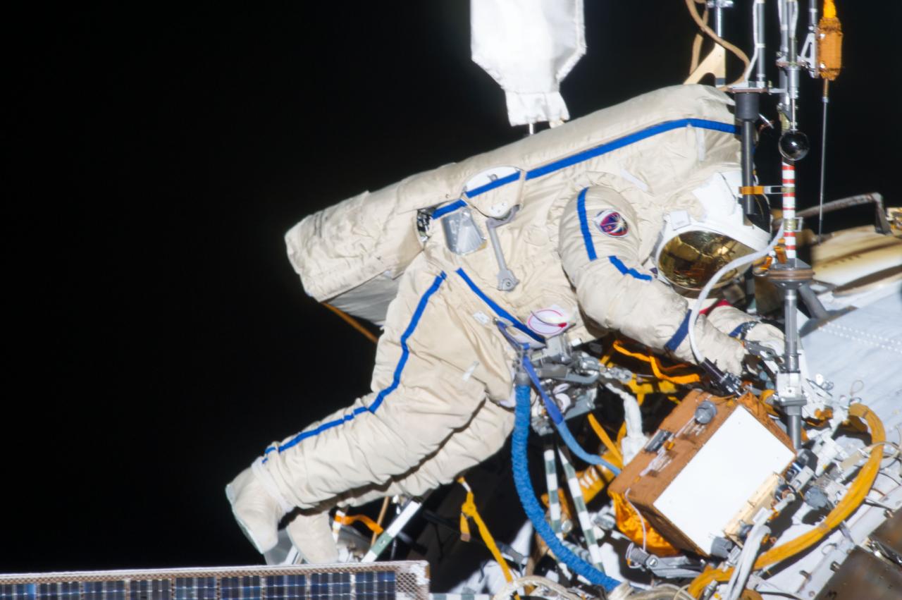 ISS035-E-023978 (19 April 2013) --- Expedition 35 Russian cosmonaut Pavel Vinogradov translates outside the International Space Station on April 19, 2013, during the first spacewalk of the Expedition 35 mission.  Vinogradov and Roman Romanenko (out of frame) went on to spend about six hours upgrading the station's exterior hardware. 