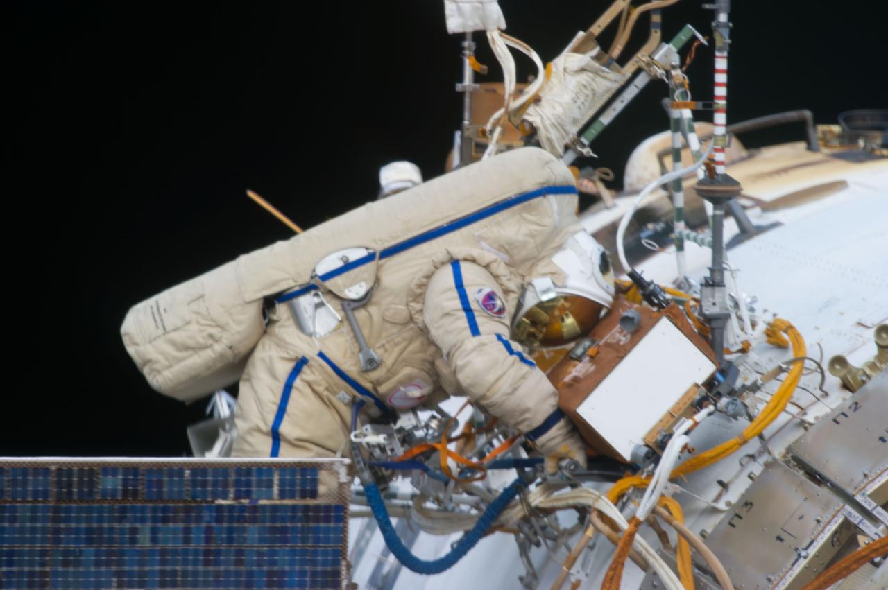 ISS035-E-027794 (19 April 2013) --- Expedition 35 Russian cosmonaut Pavel Vinogradov translates outside the International Space Station on April 19, 2013, during the first spacewalk of the Expedition 35 mission.  Vinogradov and Roman Romanenko (out of frame) went on to spend about six hours upgrading the station's exterior hardware.