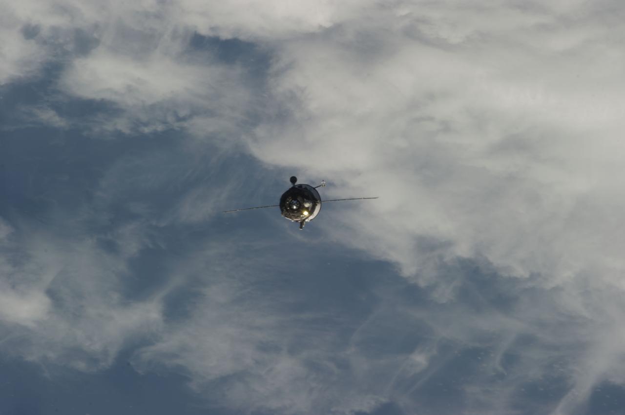 ISS035-E-029899 (26 April 2013) --- Backdropped by clouds, the Russian Progress 51 cargo craft approaches the International Space Station (out of frame) on April 26, 2013. The unmanned cargo vehicle later successfully docked with the orbital outpost.