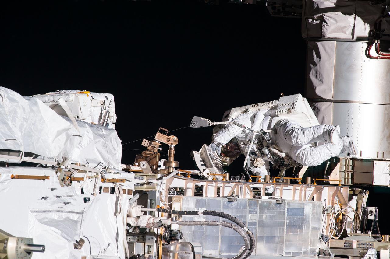 ISS035-E-036829 (11 May 2013) --- Expedition 35 Flight Engineers Tom Marshburn (pictured) and Chris Cassidy (out of frame) completed a space walk at 2:14 p.m. EDT May 11 to inspect and replace a pump controller box on the International Space Station?s far port truss (P6) leaking ammonia coolant. The two NASA astronauts began the 5-hour, 30-minute space walk at 8:44 a.m.