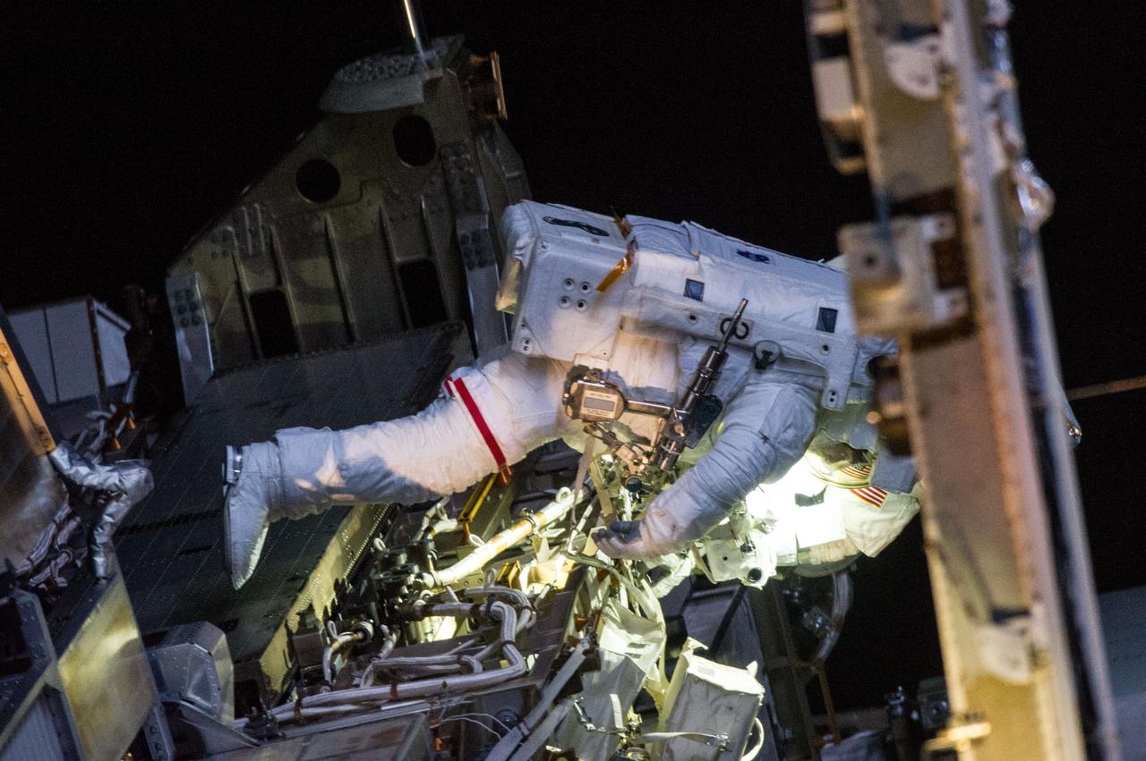 ISS035-E-040237 (11 May 2013) --- Expedition 35 Flight Engineers Chris Cassidy (pictured) and Tom Marshburn (out of frame) completed a space walk at 2:14 p.m. EDT May 11 to inspect and replace a pump controller box on the International Space Station's far port truss (P6) leaking ammonia coolant. The two NASA astronauts began the 5-hour, 30-minute space walk at 8:44 a.m.