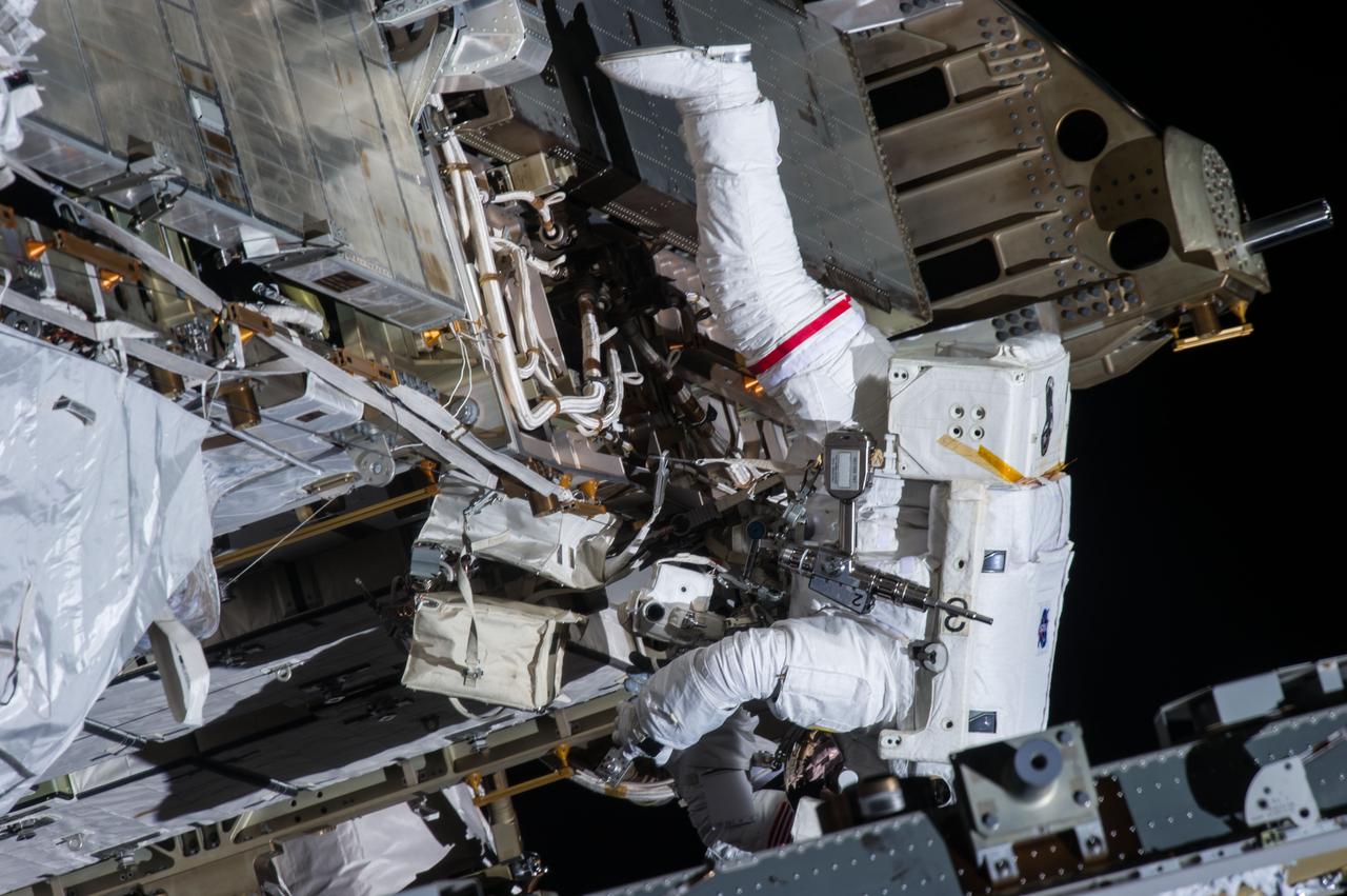 ISS035-E-040239 (11 May 2013) --- Expedition 35 Flight Engineers Chris Cassidy (pictured) and Tom Marshburn (out of frame) completed a space walk at 2:14 p.m. EDT May 11 to inspect and replace a pump controller box on the International Space Station's far port truss (P6) leaking ammonia coolant. The two NASA astronauts began the 5-hour, 30-minute space walk at 8:44 a.m.
