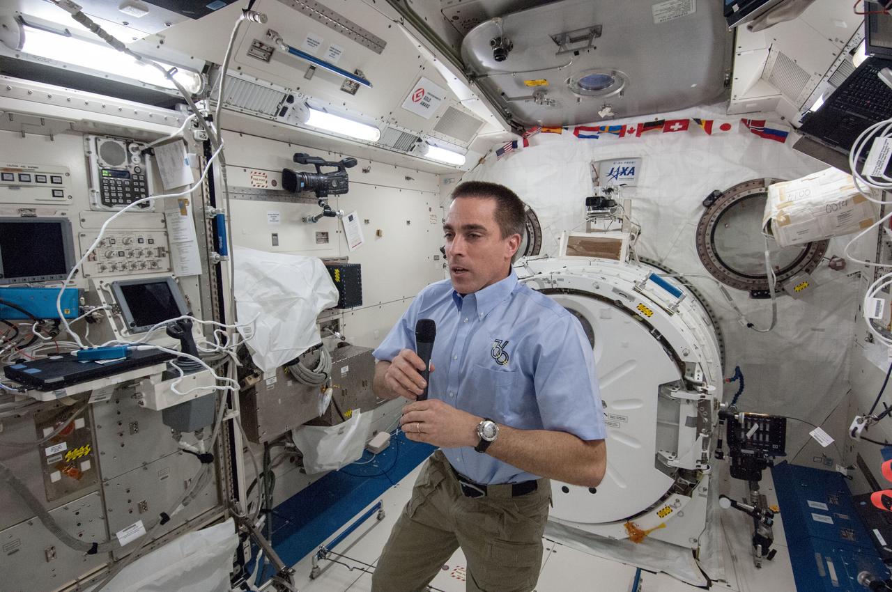 ISS036-E-003252 (22 May 2013) --- In the JAXA Kibo lab of the International Space Station, Expedition 35 Flight Engineer Chris Cassidy of NASA speaks with an aggregate of Florida students and a Florida reporter and an educator during an event that allowed a series of questions and answers on May 22, 2013.