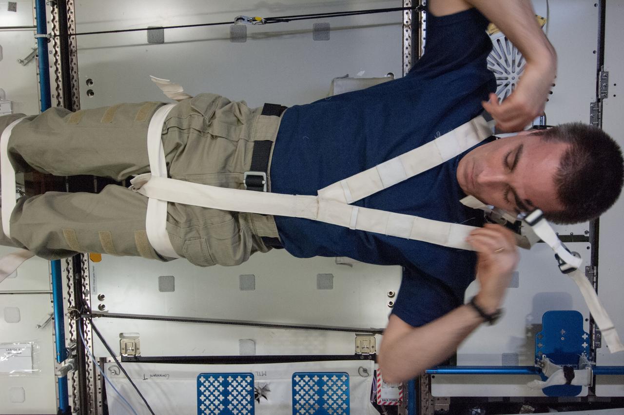 ISS036-E-003301 (22 May 2013) --- In the Destiny lab aboard the International Space Station, NASA astronaut Chris Cassidy, Expedition 36 flight engineer, participates in a Crew Medical Restraint System (CMRS) checkout.