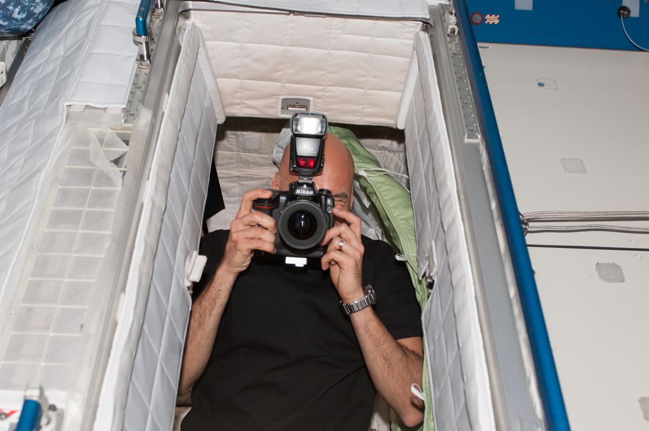 ISS036-E-005320 (29 May 2013) --- Having just come aboard the International Space Station,  European Space Agency astronaut Luca Parmitano, Expedition 36 flight engineer, takes some interior pictures in the Harmony node. He later added a large lens and took some out-the-window scenes after moving to the Cupola aboard the orbital outpost. He is beginning a scheduled 5 1/2 month stay aboard the space station.