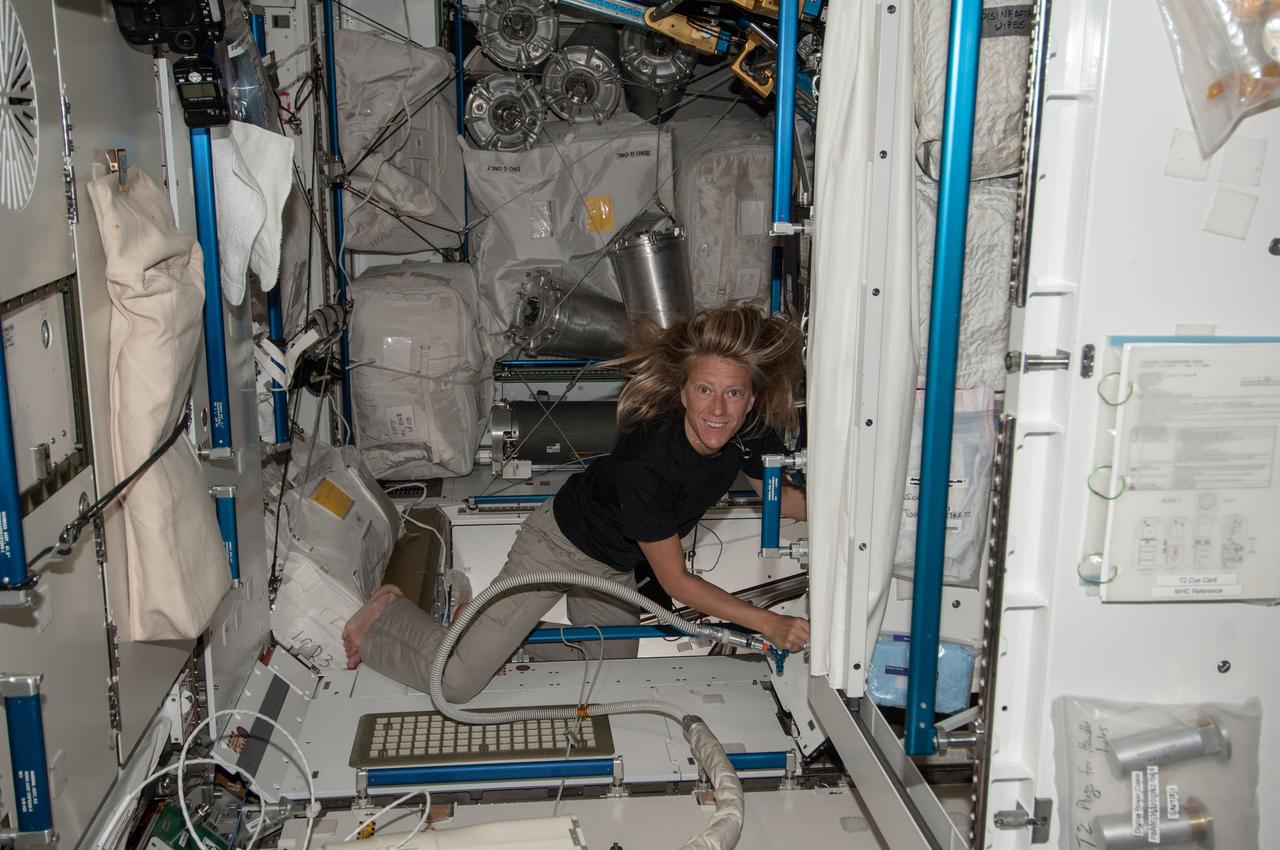 Astronaut Karen Nyberg,Expedition 36 flight engineer,is photographed at work in the U.S. Laboratory module.
