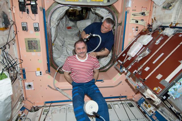 NASA image: Vinogradov receives haircut