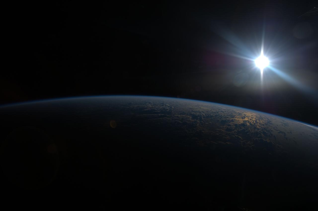 ISS036-E-005813 (2 June 2013) --- One of the Expedition 36 crew members aboard the International Space Station, flying at altitude of approximately 257 miles above the Indian Ocean, recorded this image of the sun about to go down on June 2, 2013.