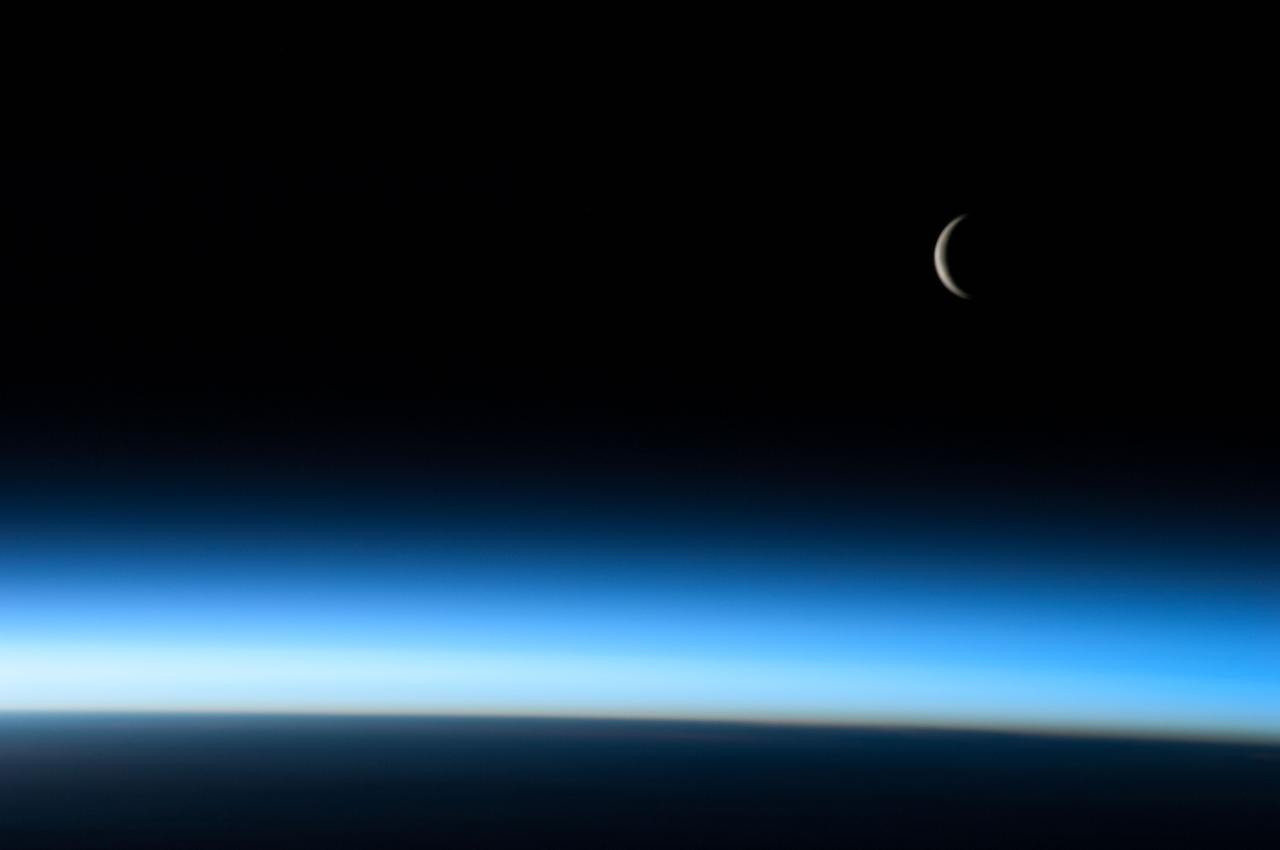 ISS036-E-006179 (4 June 2013) --- One of the Expoedition 36 crew members aboard the International Space Station captured an image of a crescent moon above Earth's atmosphere on June 4, 2013.