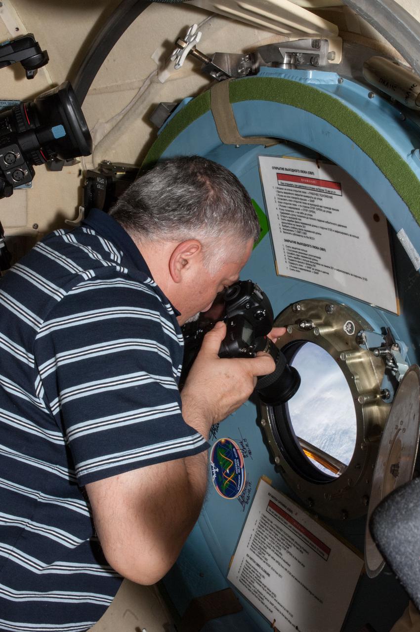 ISS036-E-008182 (15 June 2013) --- Expedition 36 Flight Engineer Fyodor Yurchikhin with Russia's Federal Space Agency (Roscosmos) takes pictures of a highly anticipated event from a window in the Pirs module on the International Space Station. The European Space Agency's Automated Transfer Vehicle-4 (ATV-4) “Albert Einstein” was about to dock to the orbital outpost at 2:07 GMT, June 15, 2013, following a ten-day period of free-flight.