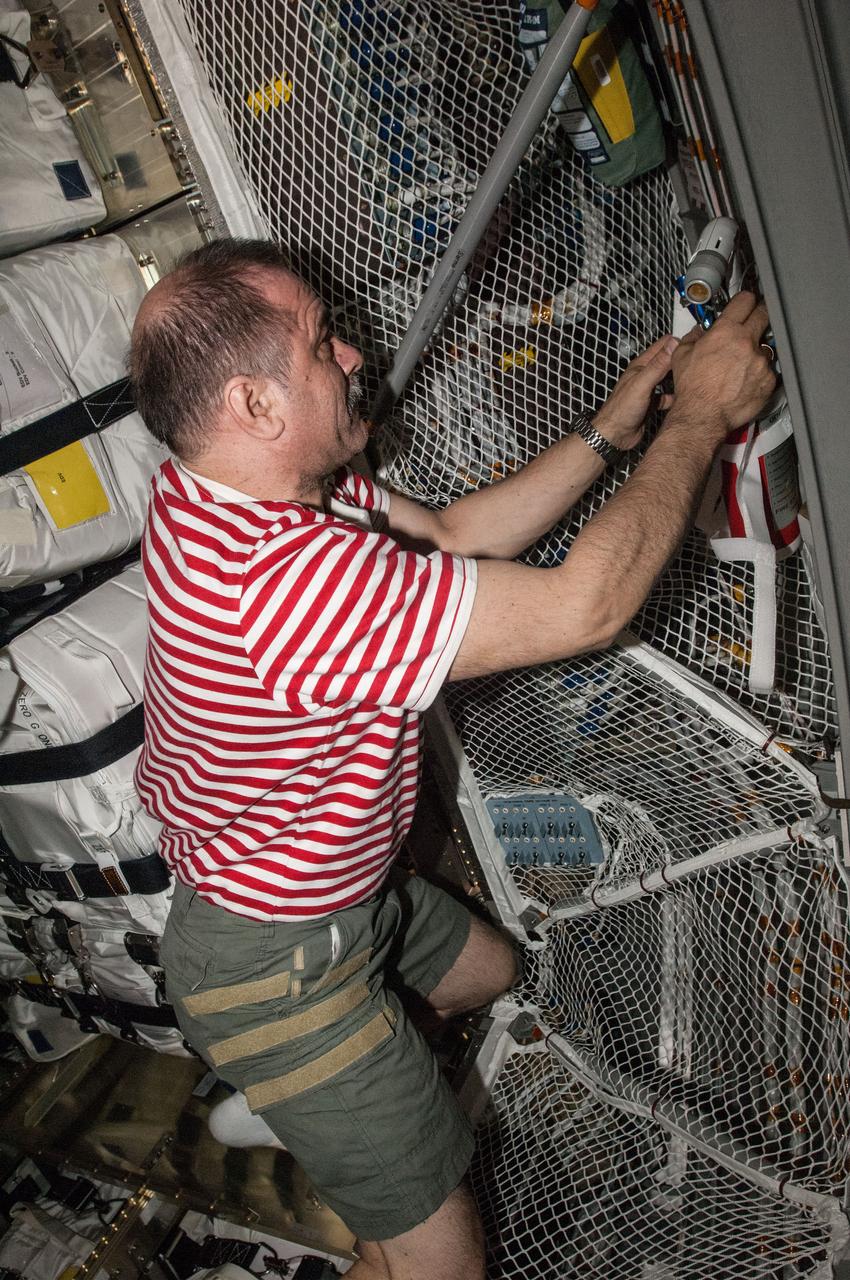 ISS036-E-009219 (18 June 2013) --- Russian cosmonaut Pavel Vinogradov, Expedition 36 commander, performs cargo operations in the European Space Agency's Automated Transfer Vehicle-4 (ATV-4) "Albert Einstein" currently docked to the Zvezda Service Module of the International Space Station.