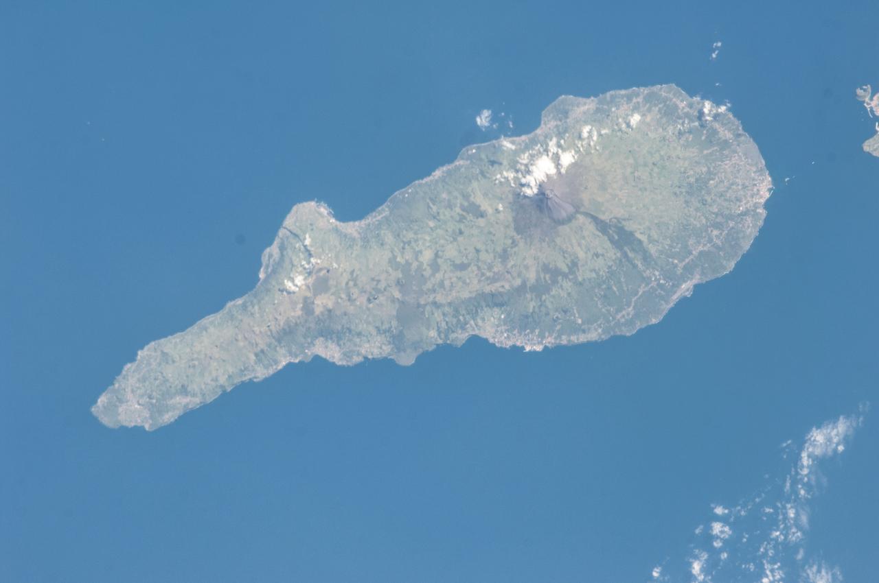 ISS036-E-009390 (18 June 2013) --- One of the Expedition 36 crew members used a 180mm lens to photograph this vertical view of the island of Pico, the second largest of the Portuguese Azores in the North Atlantic Ocean. Mt. Pico, a prominent 2351-meter-high stratovolcano on the eastern end of Pico Island is the highest volcano in the Azores. Madalena is a municipality along the coast, home to about 6,000 inhabitants.