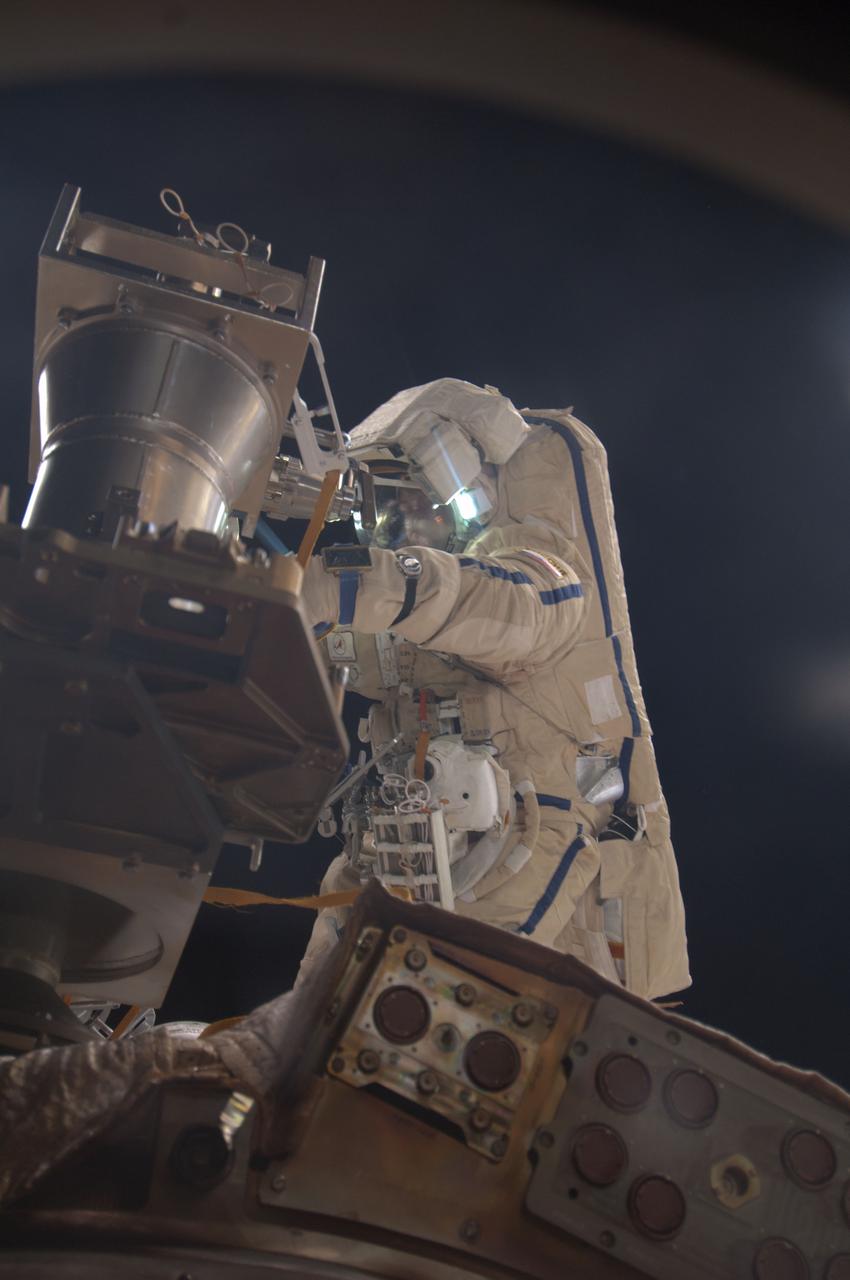 ISS036-E-011440 (24 June 2013) --- Russian cosmonaut Alexander Misurkin, Expedition 36 flight engineer, participates in a session of extravehicular activity (EVA) as work continues on the International Space Station. During the six-hour, 34-minute spacewalk, Misurkin and Russian cosmonaut Fyodor Yurchikhin (out of frame), Expedition 36 flight engineer, replaced an aging fluid flow control panel on the station's Zarya module as preventative maintenance on the cooling system for the Russian segment of the station. They also installed clamps for future power cables as an early step toward swapping the Pirs airlock with a new multipurpose laboratory module. The Russian Federal Space Agency plans to launch a combination research facility, airlock and docking port late this year on a Proton rocket. Yurchikhin and Misurkin also retrieved two science experiments and installed one new one.
