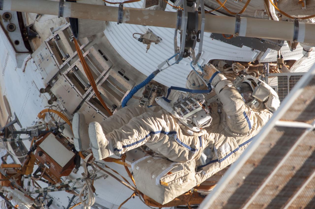 ISS036-E-011640 (24 June 2013) --- Russian cosmonaut Alexander Misurkin, Expedition 36 flight engineer, participates in a session of extravehicular activity (EVA) as work continues on the International Space Station. During the six-hour, 34-minute spacewalk, Misurkin and Russian cosmonaut Fyodor Yurchikhin (out of frame), Expedition 36 flight engineer, replaced an aging fluid flow control panel on the station's Zarya module as preventative maintenance on the cooling system for the Russian segment of the station. They also installed clamps for future power cables as an early step toward swapping the Pirs airlock with a new multipurpose laboratory module. The Russian Federal Space Agency plans to launch a combination research facility, airlock and docking port late this year on a Proton rocket. Yurchikhin and Misurkin also retrieved two science experiments and installed a new one.