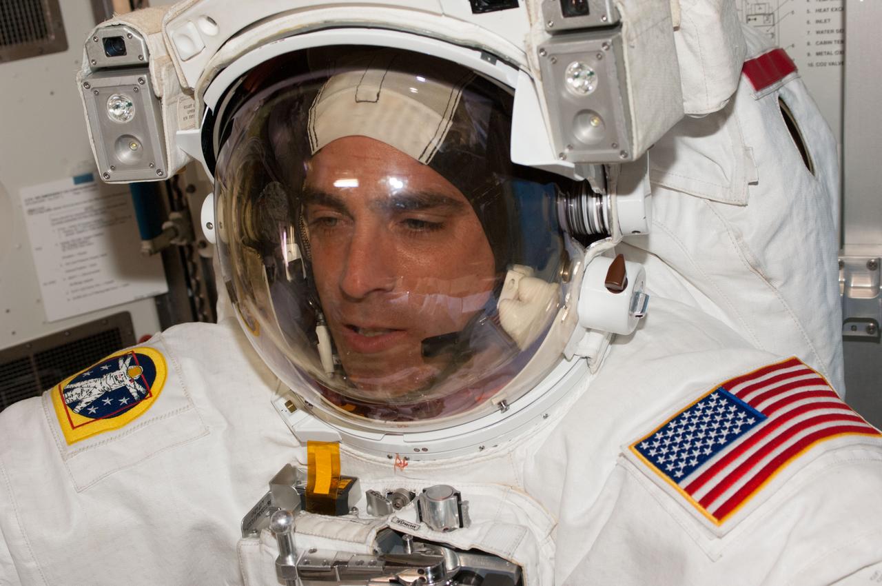 ISS036-E-014659 (3 July 2013) --- NASA astronaut Chris Cassidy, Expedition 36 flight engineer, attired in his Extravehicular Mobility Unit (EMU) spacesuit, participates in a ?dry run? in the International Space Station?s Quest airlock in preparation for the first of two sessions of extravehicular (EVA) scheduled for July 9 and July 16.