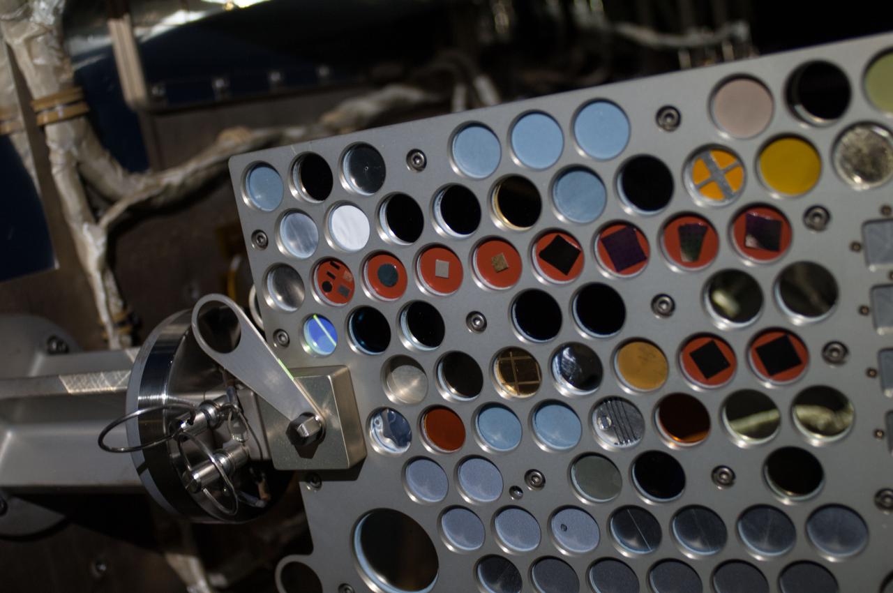 iss036e016736 (7/9/2013) --- Close-up view of the Optical Reflector Materials Experiment III Ram/Wake (ORMatE-III R/W) which is part of the Materials on International Space Station Experiment - 8 (MISSE-8) installed on the starboard truss. View was taken during a session of extravehicular activity (EVA) 22 as work continues on the International Space Station.