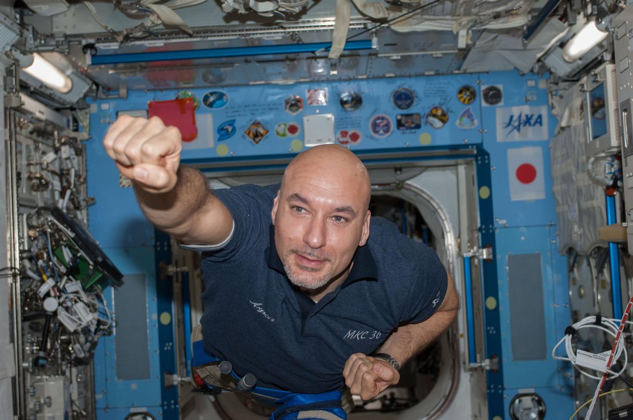 ISS036-E-020931 (17 July 2013) --- European Space Agency astronaut Luca Parmitano, Expedition 36 flight engineer, strikes a pose as he floats freely in the Kibo laboratory of the International Space Station.