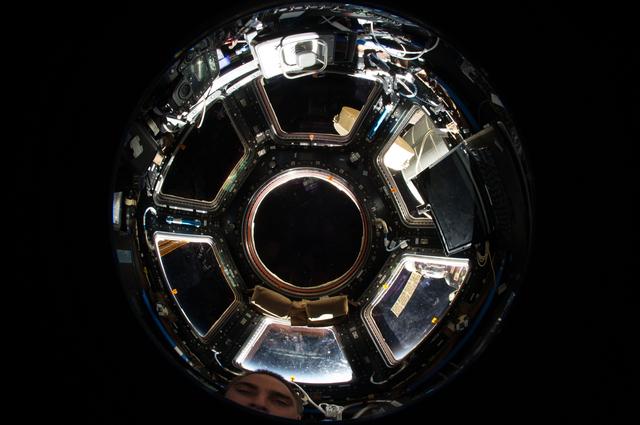 NASA image: Fisheye (wide lens) view into Cupola