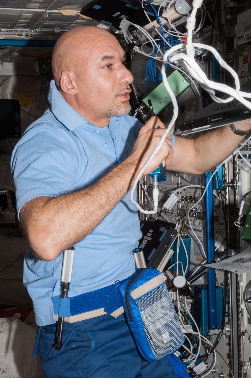 ISS036-E-023749 (21 July 2013) --- European Space Agency astronaut Luca Parmitano, Expedition 36 flight engineer, speaks in a microphone while working in the Columbus laboratory of the International Space Station.