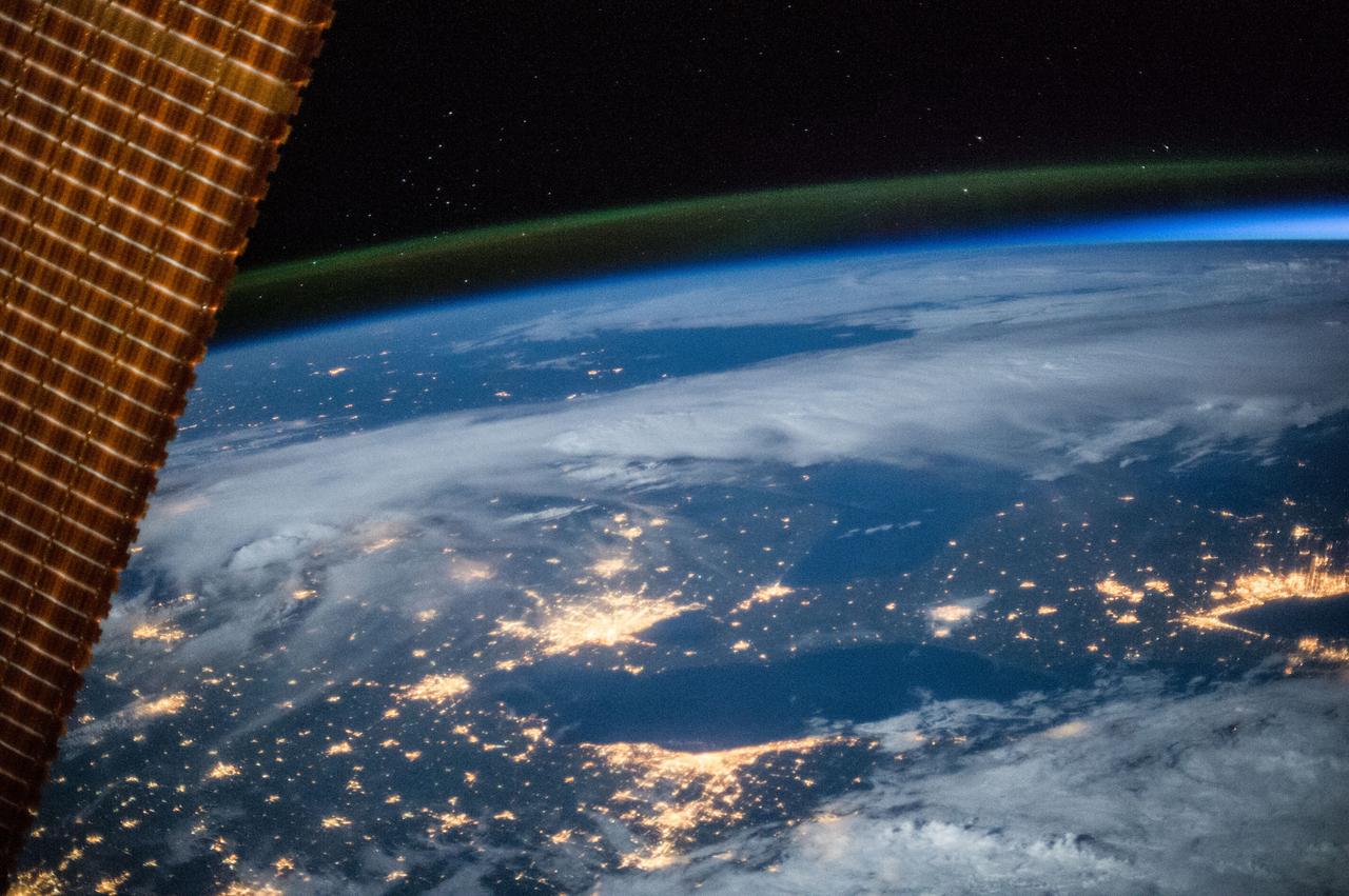 Earth observation taken during a night pass by an Expedition 36 crew member on board the International Space Station (ISS).  Per Twitter message this is labeled as: Detroit, Cleveland, Toronto and a blue hint of sunrise.