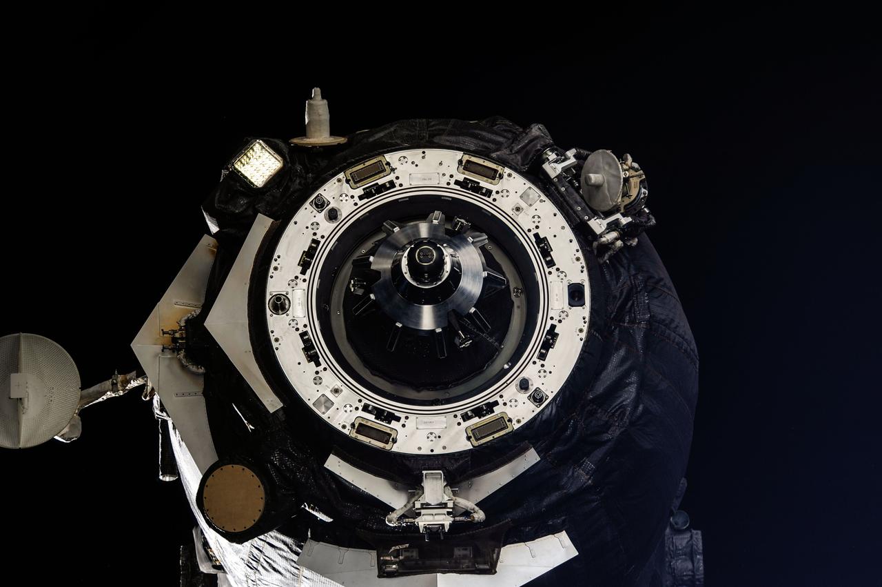 ISS036-E-024927 (25 July 2013) --- This close-up view shows the docking mechanism of the unpiloted Russian ISS Progress 50 (50P) resupply ship as it undocks from the International Space Station?s Pirs Docking Compartment at 4:43 p.m. (EDT) on July 25, 2013. The Progress 50 deorbited over the Pacific Ocean a few hours later for a fiery destruction. An ISS Progress 52 is set to replace the 50P when it launches at 4:45 p.m. on July 27 from the Baikonur Cosmodrome in Kazakhstan.