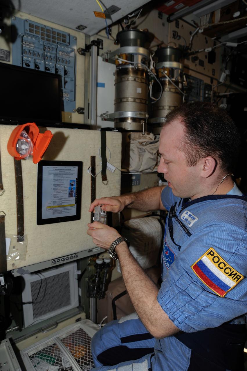 ISS036-E-025449 (29 July 2013) --- Russian cosmonaut Alexander Misurkin, Expedition 36 flight engineer, works on various science and maintenance activities in the Zvezda Service Module of the International Space Station.