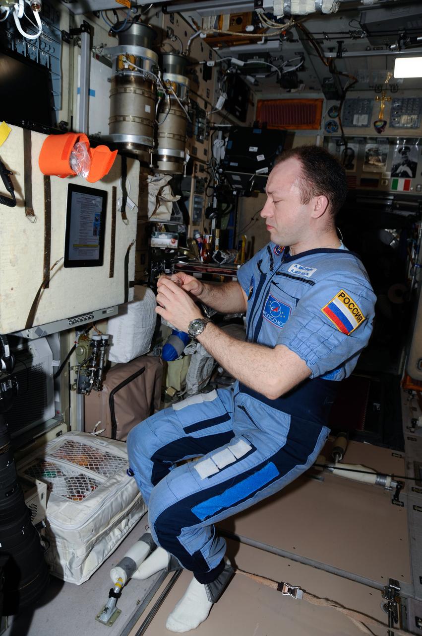 ISS036-E-025453 (29 July 2013) --- Russian cosmonaut Alexander Misurkin, Expedition 36 flight engineer, works on various science and maintenance activities in the Zvezda Service Module of the International Space Station.