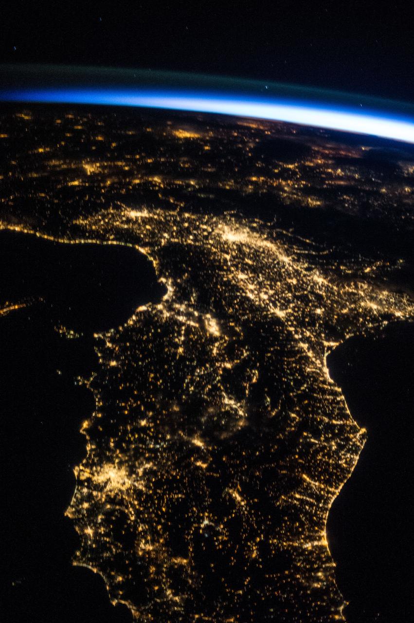 ISS036-E-025994 (29 July 2013) --- One of the Expedition 36 crew members aboard the International Space Station photographed this oblique, north-looking nighttime image of parts of Italy on July 29, 2013. Rome is well lighted and clearly visible on the Mediterranean coast in the lower left quadrant. Much of the Adriatic Sea coast is visible on the right side of the frame