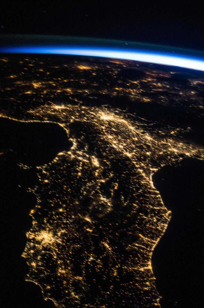 ISS036-E-026000 (29 July 2013) --- One of the Expedition 36 crew members aboard the International Space Station photographed this   oblique, north-looking nighttime image of parts of Italy on July 29, 2013.  Rome is well lighted and cleary visible on the Mediteranean coast in the lower left quadrant.  Much of the Adriatic Sea coast is visible on the right side of the frame.