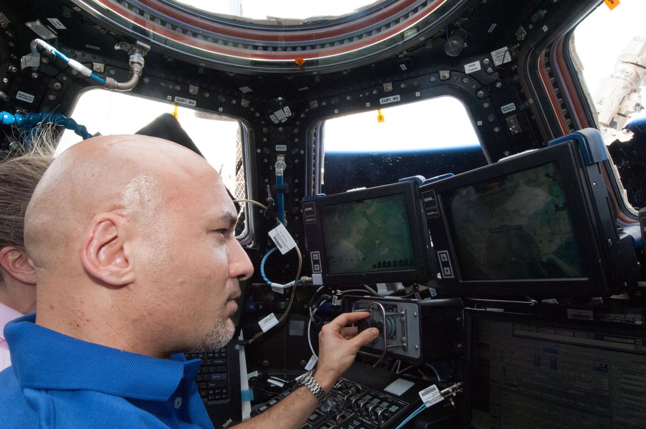 ISS036-E-026326 (29 July 2013) --- In the International Space Station?s Cupola, European Space Agency astronaut Luca Parmitano, Expedition 36 flight engineer, participates in an onboard training activity in preparation for the grapple and berthing of the Japanese ?Kounotori? H2 Transfer Vehicle-4 (HTV-4) set for August 9.