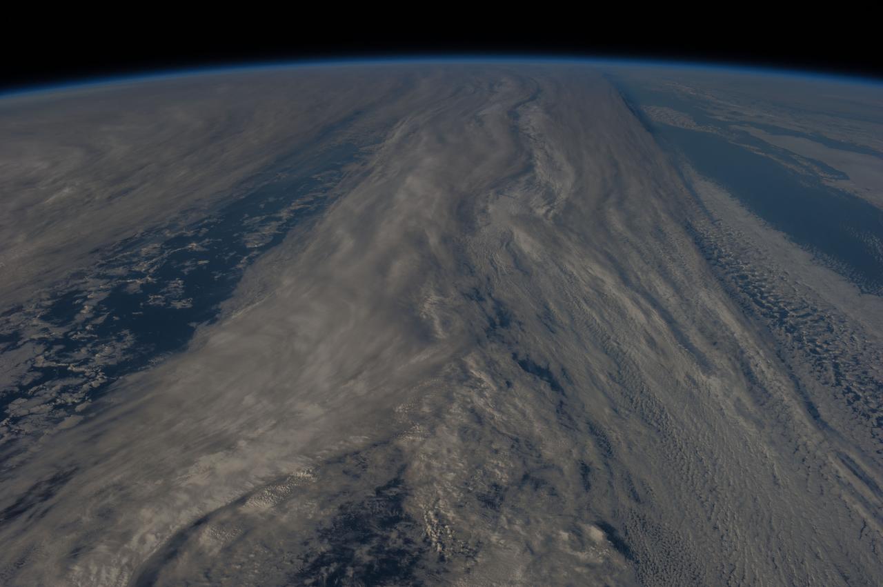 Earth observation taken during day pass by an Expedition 36 crew member on board the International Space Station (ISS). Per Twitter message: From southernmost point of orbit over the South Pacific- all clouds seemed to be leading to the South Pole.