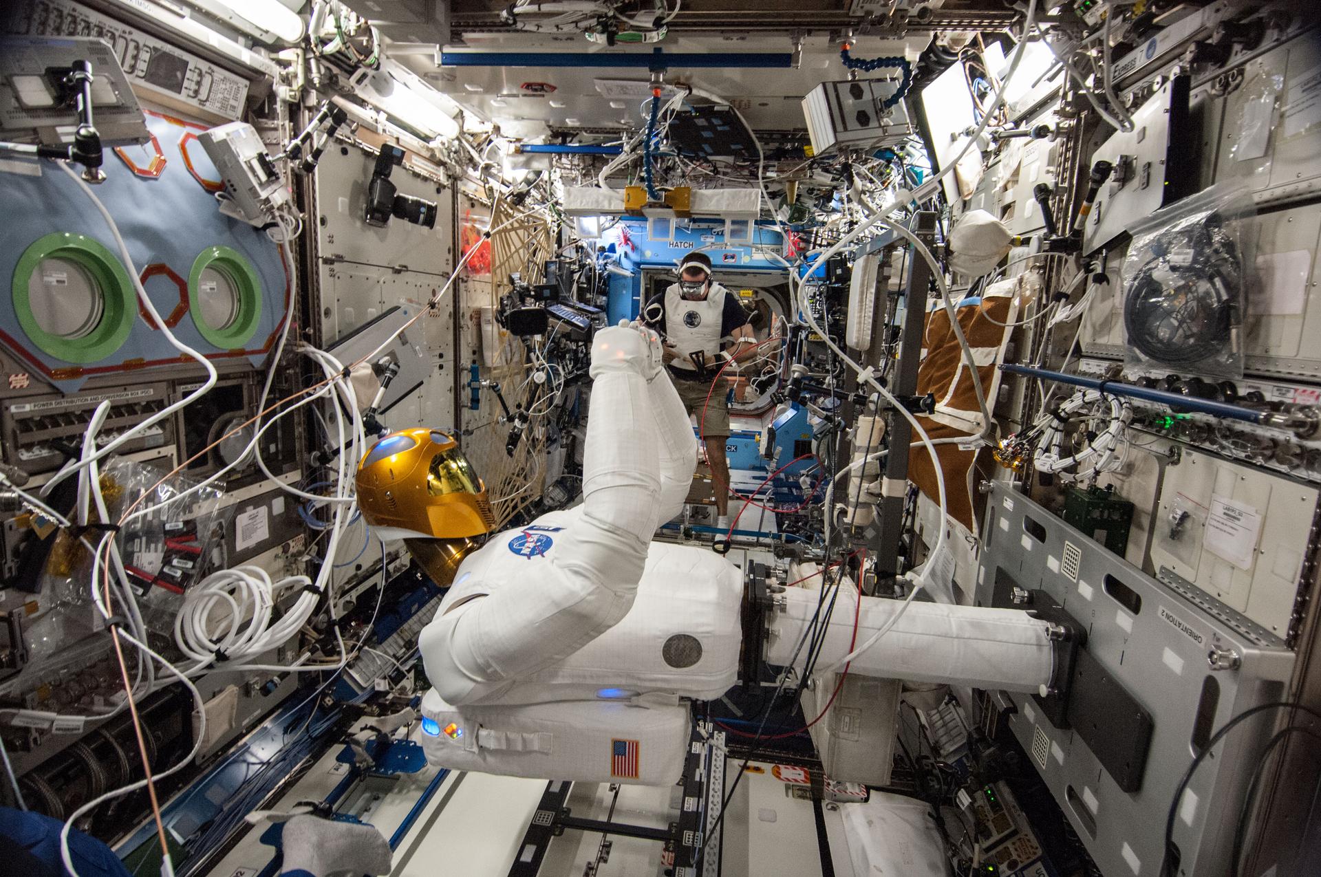 In the International Space Station's Destiny laboratory, NASA astronaut Chris Cassidy wears tele-operation gear