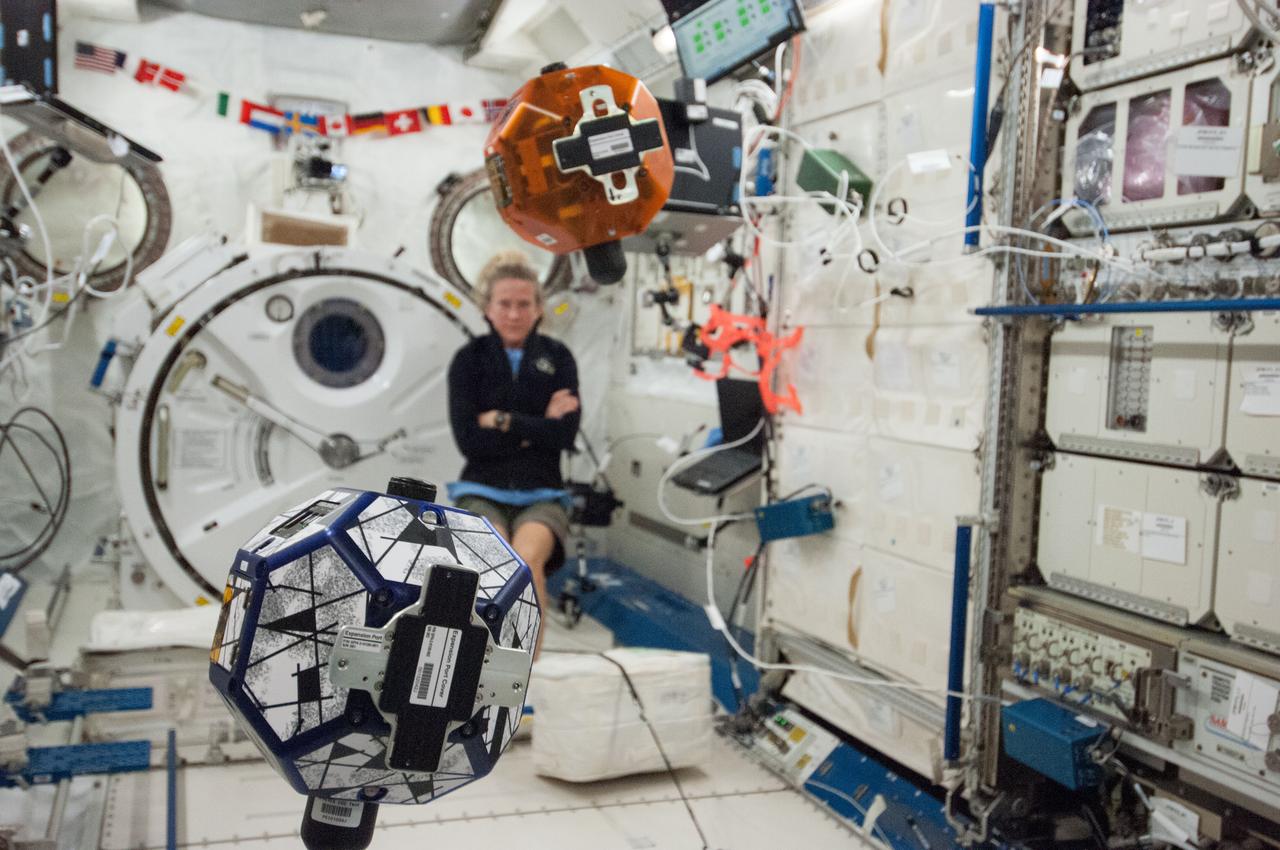 Astronaut Karen Nyberg, Expedition 36 flight engineer, conducts a session with the  bowling-ball-sized free-flying satellite known as Synchronized Position Hold, Engage, Reorient, Experimental Satellites, or SPHERES in the International Space Stations Japanese Experiment Module (JEM) Kibo laboratory.  Also sent as Twitter message.