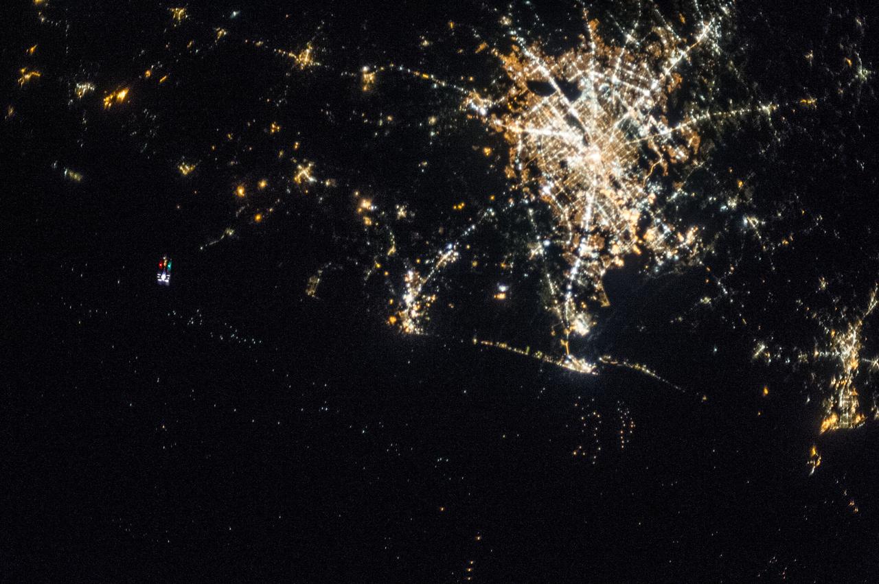 The unpiloted Japanese "Kounotori" H2 Transfer Vehicle-4 (HTV-4) approaches the International Space Station. View  taken by the Expedition 36 crew during a night pass. Per Twitter message: #HTV4, with its red & green lights, approaching #ISS from below as we passed over Houston earlier today.