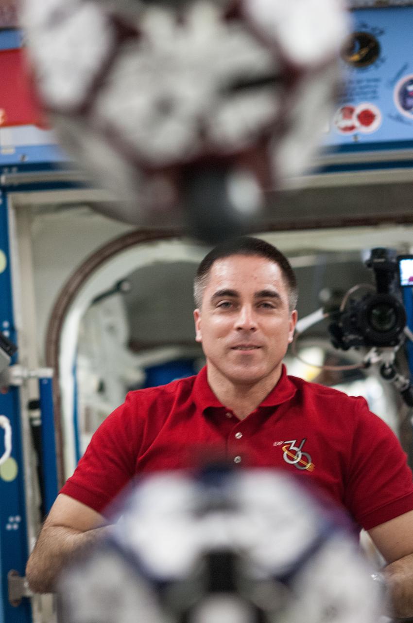 ISS036-E-031684 (13 Aug. 2013) --- In the International Space Station’s Kibo laboratory, NASA astronaut Chris Cassidy, Expedition 36 flight engineer, conducts a session with a pair of bowling-ball-sized free-flying satellites known as Synchronized Position Hold, Engage, Reorient, Experimental Satellites, or SPHERES.