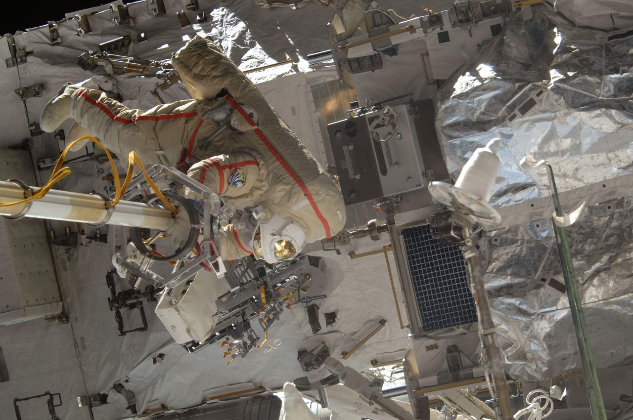 ISS036-E-033160 (16 Aug. 2013) --- Russian cosmonaut Fyodor Yurchikhin, Expedition 36 flight engineer, attired in a Russian Orlan spacesuit, participates in a session of extravehicular activity (EVA) to continue outfitting the International Space Station. During the seven-hour, 29-minute spacewalk ? the longest ever conducted by a pair of Russian cosmonauts ? Yurchikhin and Alexander Misurkin (out of frame) rigged cables for the future arrival of a Russian laboratory module and installed an experiment panel.